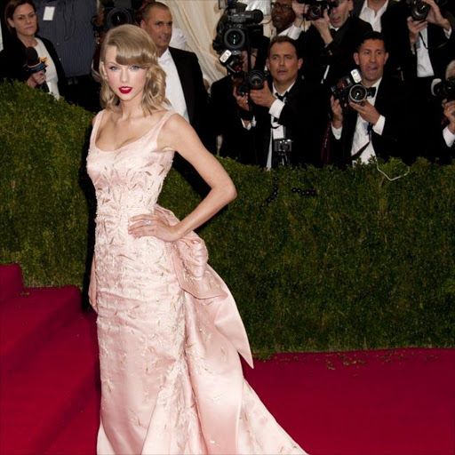 Taylor Swift wearing Oscar de la Renta at the Costume Institute Gala in May.