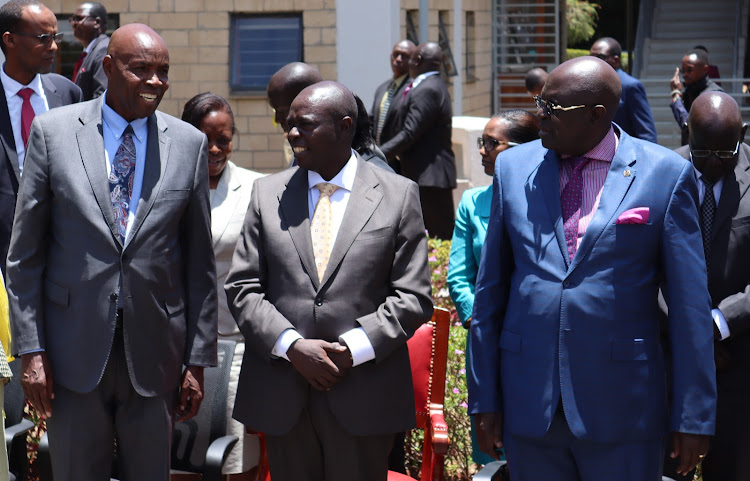 Education CS nominee Ezekiel Machogu, Deputy President Rigathi Gachagua and outgoing Education CS George Magoha during the launch of a three-day induction for the Education Reforms Taskforce at the Centre For Mathematics, Science and Technology Education in Africa in Nairobi on Wednesday, October 12.