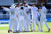  Proteas players celebrate with Marco Jansen after he claimed the the last wicket of James Anderson to secure first Test victory over England at Lord's Cricket Ground on August 19, 2022 in London, England.