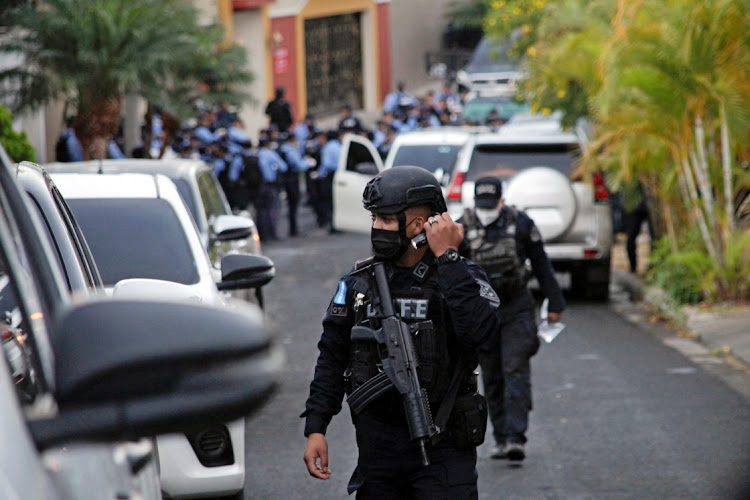 Police officers surround the house of former Honduran president Juan Orlando Hernandez after the US requested his arrest and extradition, in Tegucigalpa, Honduras, February 15 2022. Picture: FREDY RODRIGUEZ/REUTERS