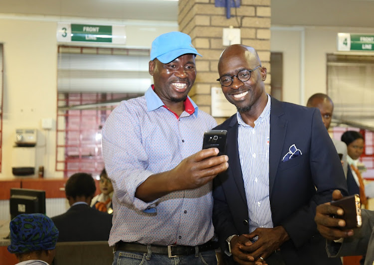 Sibusiso Mawota takes a selfie with Minister Malusi Gigaba at Department of Home affairs in Pietermaritzburg.