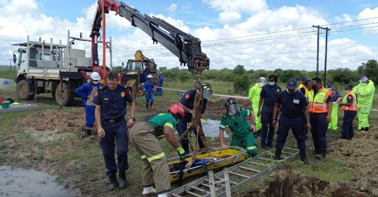 Rescue workers used a stretcher and crane to hoist the injured man back to safety.