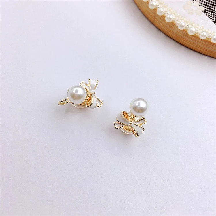 Boucles d'oreilles vintage papillon perle sans perçage, un accessoire intemporel pour un look élégant et un confort optimal quotidien