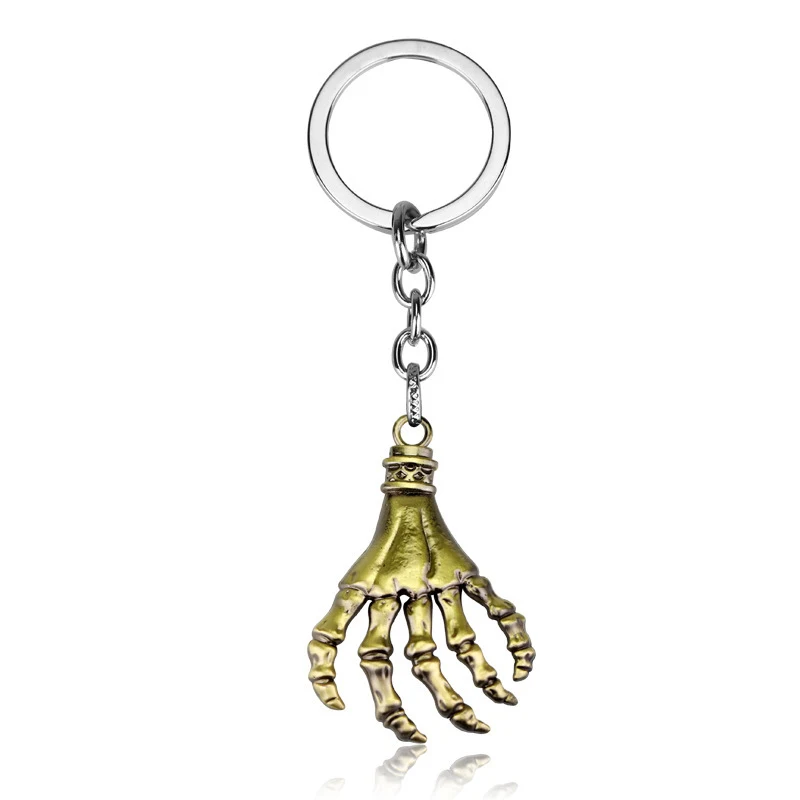 Porte-clés créatif avec pendentif tête de mort et paume, cadeau original et stylé, accessoire parfait pour clés, sacs, un design unique et moderne.