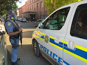 Police guarding the Cape Town magistrate's court precinct during an appearance by gang members. File image