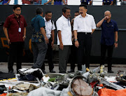 Lion Air CEO Edward Sirait (center L) and owner Rusdi Kirana (center R) inspect the recovered debris of Lion Air flight JT610 at Tanjung Priok port in Jakarta, Indonesia, October 30, 2018. 