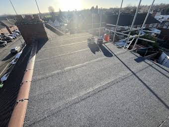 Flat roof replacement including dry ridge system album cover