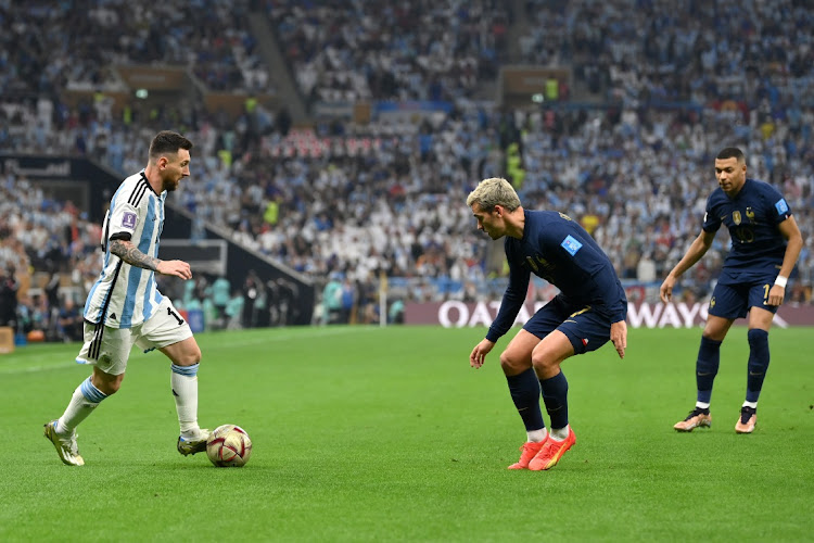 Lionel Messi of Argentina controls the ball against Antoine Griezmann of France during the Fifa World Cup Qatar 2022 final match between Argentina and France at Lusail Stadium in Lusail City, Qatar, December 18 2022. Picture: DAN MULLAN/GETTY IMAGES