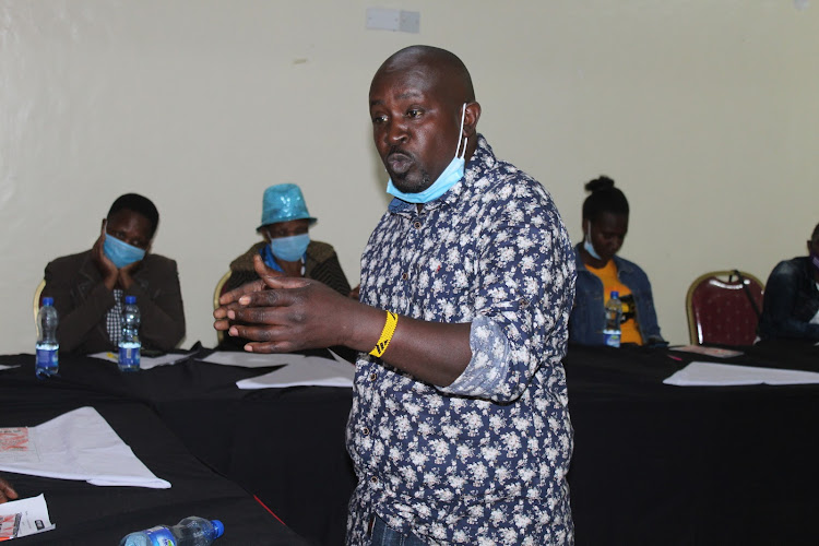 Samuel Wandimi of InformAction speaks to the CSO members during the meeting in Kirinyaga on Friday