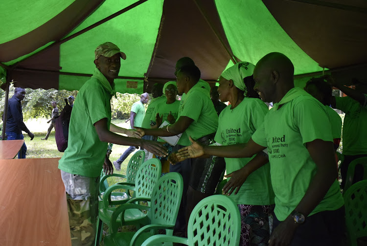 The United Green Movement (UGM) party leader Agostino Neto greets members during election of officials in Ndhiwa town on May 16,2023