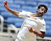 Indian bowler Praveen Kumar bowls during the second day of the first test between West Indies and India at Sabina Park in Kingston, Jamaica, June 21, 2011