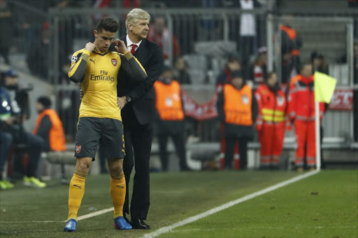 Arsenal's French manager Arsene Wenger (R) brings on Arsenal's Brazilian defender Gabriel during the UEFA Champions League round of sixteen football match between FC Bayern Munich and Arsenal in Munich, southern Germany, on February 15, 2017.