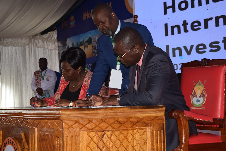 Homa Bay Governor Gladys Wanga during signing of an MoU at the county second edition of international investment conference at Tom Mboya University grounds on February 28,2024