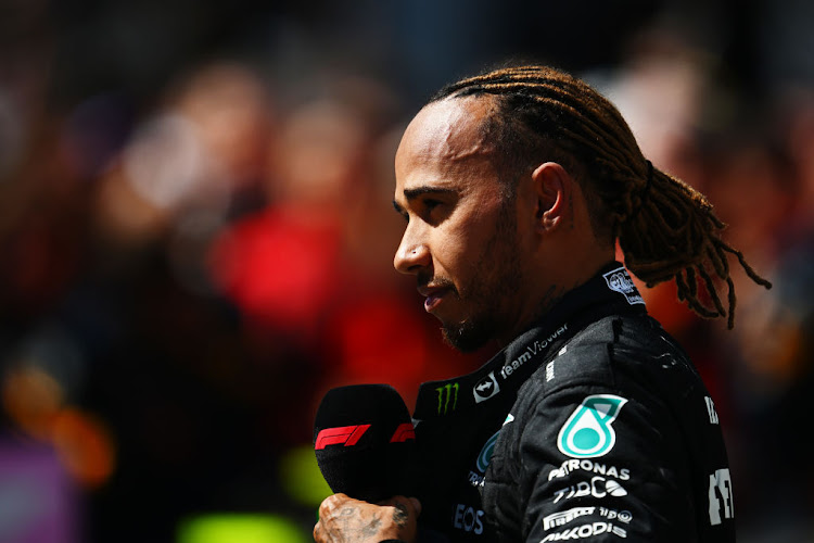 Nelson Piquet apologised to Lewis Hamilton on Wednesday after a video emerged of him using an apparent racial slur in Portuguese when referring to the Mercedes driver.