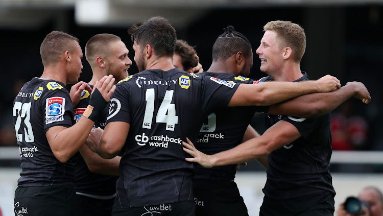 Robert du Preez Jnr. celebrates with teammates during the Super Rugby match between Sharks and NSW Waratahs at GrowthPoint Kings Park, Durban South Africa on the 03 March 2018.