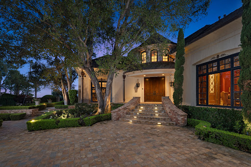House facade with illuminated garden in this luxury house for sale in Laguna Niguel ($12,000,000)