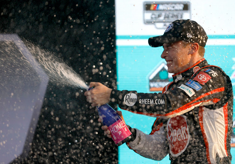 Christopher Bell celebrates in victory lane after winning the Nascar Cup Series 4Ever 400 Presented by Mobil 1 at Homestead-Miami Speedway on October 22 2023 in Homestead, Florida.