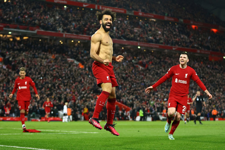 Liverpool's Mohamed Salah celebrates scoring their sixth goal.