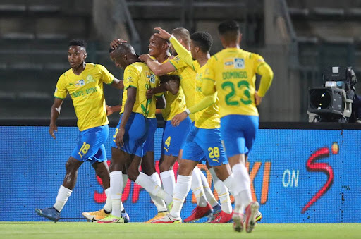 Divine Lunga of Mamelodi Sundowns celebrates his goal with teammates during their MTN8 semifinal match against Golden Arrows at Lucas Moripe Stadium on September 28, 2021 in Pretoria