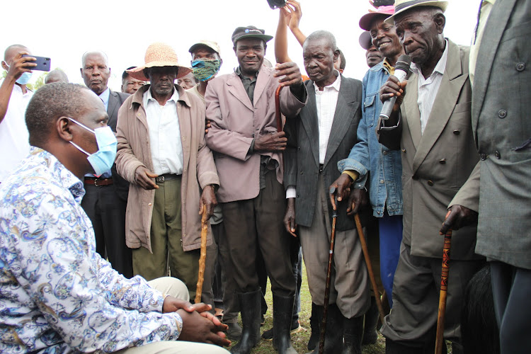 ODM party national chairman John Mbadi (seated) is installed as an elder by Kanyamwa Council of Elders in Nyamanga, Ndhiwa constituency, on October 30,2020