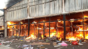 A fire engulfs Campsdrift Park, which houses Makro and China Mall, during looting in Pietermaritzburg, KwaZulu-Natal. File picture.