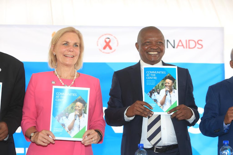 UNAid's acting executive director Gunilla Carlson holds up UNAids' global Aids update report with SA deputy president David Mabuza in Eshowe, northern KwaZulu-Natal, on Tuesday.