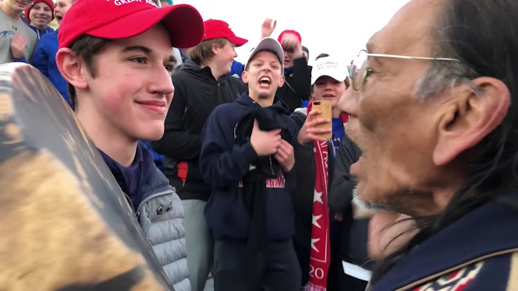 A student from Covington Catholic High School stands in front of Native American Vietnam veteran Nathan Phillips in Washington, US, in this still image from a January 18, 2019 video by Kaya Taitano.