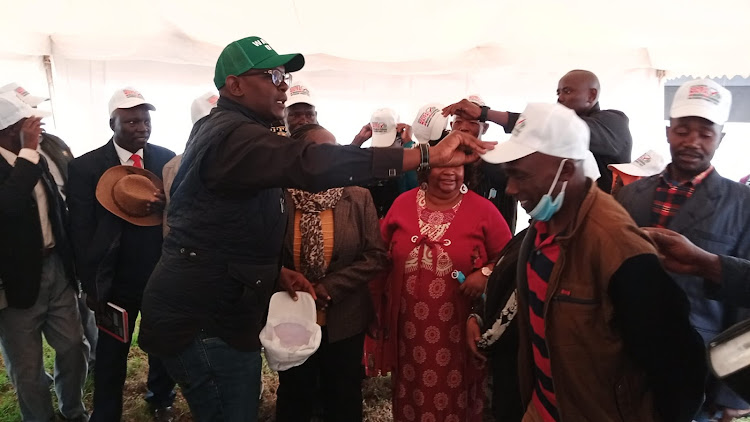 Machakos CCU gubernatorial candidate Nzioka Waita receiving Wiper party defectors at Raphael Mwangangi Memorial Centre in Machakos town on Friday, July 8.