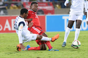 Thabiso Semenya of Platinum Stars tackles Thamsanqa Gabuza of Orlando Pirates during the Absa Premiership match between Platinum Stars and Orlando Pirates at Royal Bafokeng Stadium on May 02, 2016 in Rustenburg, South Africa. (Photo by Lee Warren/Gallo Images)