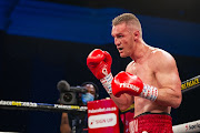 Ryno Liebenberg (red and white trunks) in action during the WBA Pan-Africa / IBO All-Africa / SA Super Middleweight Title bout of the 'D Day Has Arrived' Boxing Event at Emperors Palace on March 14, 2021 in Johannesburg.