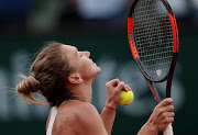 Romania's Simona Halep celebrates after winning a match. File photo 