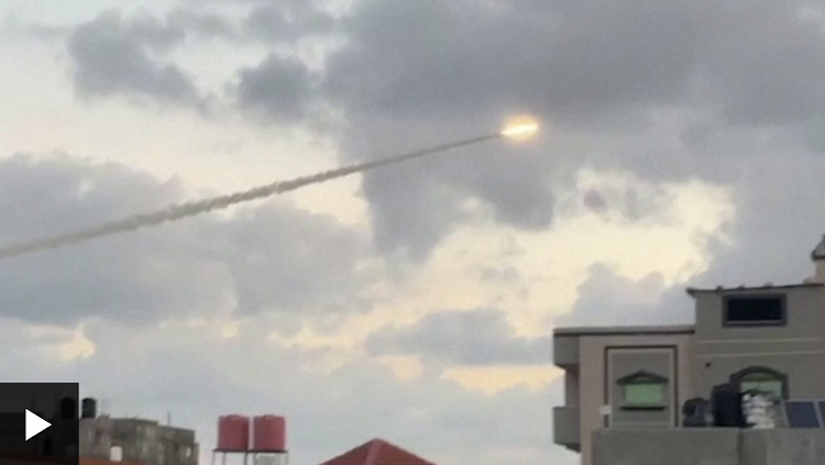 Rockets launched from Gaza streak across sky