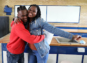 Khulisiwe Ngcamu with her pupil Takudzwa Chikonye, a top achiever in physical science at Bhukulani Secondary School in Soweto. 