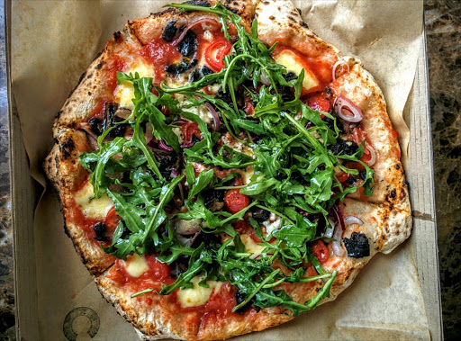 A puffed and charred border marks a true Neapolitan pizza, like this one from Coalition in Rosebank.