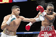 DISHING IT OUT: Welterweight Amir Khan on his way to beating Devon Alexander in their welterweight fight at the MGM Grand Garden Arena in Las Vegas, Nevada, on Saturday night