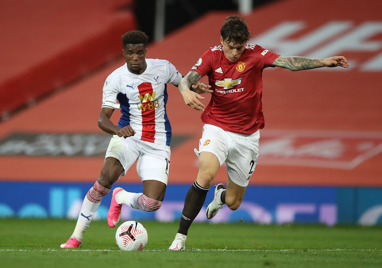 Manchester United's Victor Lindelof in action with Crystal Palace's Wilfried Zaha