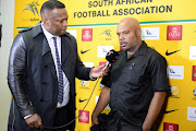 Robert Marawa speaks to Seychelles coach Gavin Jeanne during the 2019 Africa Cup of Nations qualification match between South Africa and Seychelles at FNB Stadium on October 13, 2018 in Johannesburg, South Africa. 