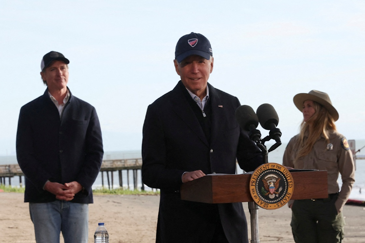 US President Joe Biden delivers remarks while California's Governor Gavin Newsom looks on, as he visits a storm-damaged area in Seacliff State Park, California, US, January 19, 2023.