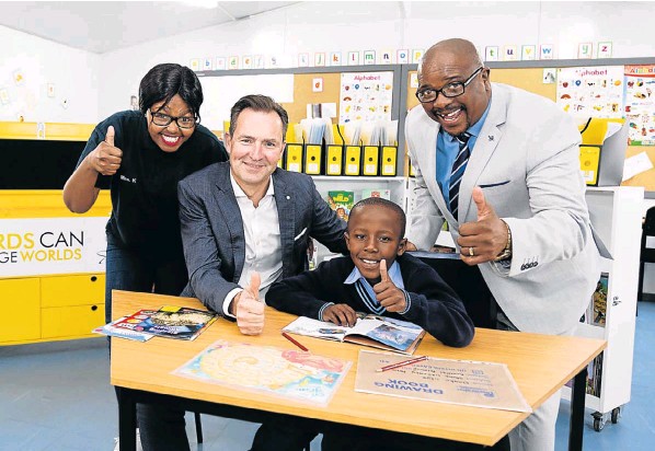 BUILDING THE FUTURE: At the launch of the new Literacy Centre at Noninzi Luzipho Primary School on Friday are, from left, Literacy Centre manager Babalwa Khona, Volkswagen Group SA chair and MD Thomas Schaefer, pupil Imanginkosi Mani, and school principal Dan Mavikela