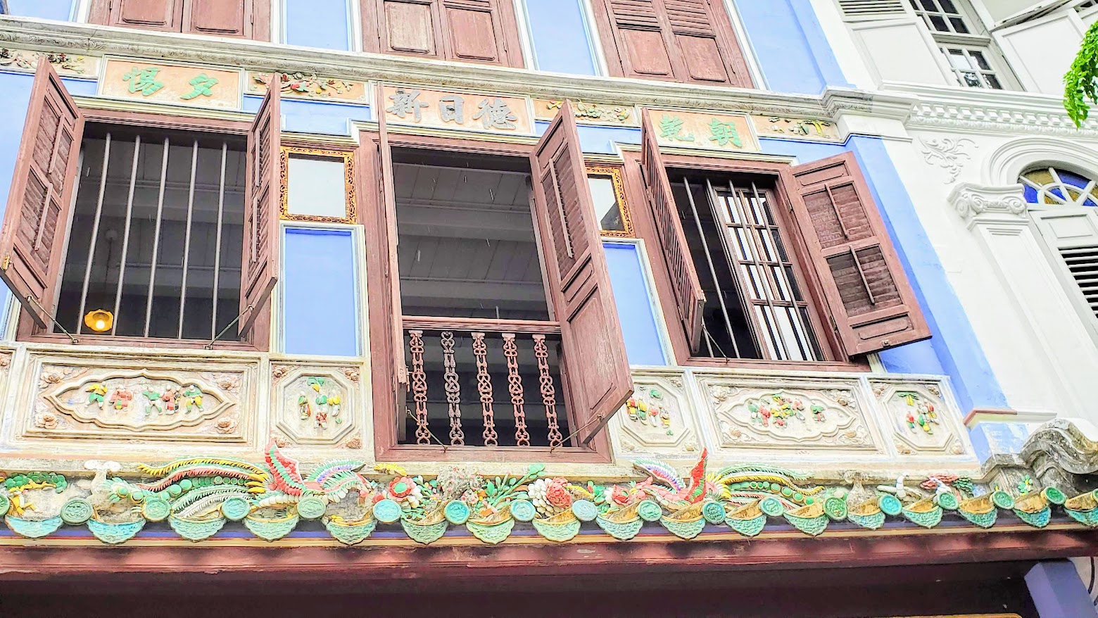 Peranakan Style Buildings in Singapore, Baba  House on Neil Street - a unique opportunity to tour a Peranakan home managed by the National University of Singapore. Tours are limited to once a day and small groups based on what the original building floors can hold, so book your reservation for a tour early