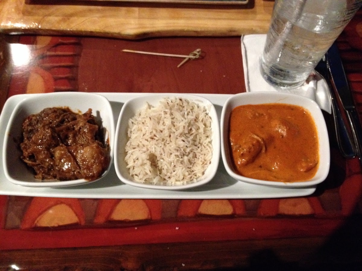 Beef short ribs, basmati rice, and butter chicken.