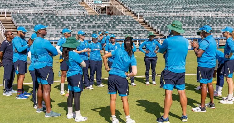 Momentum Proteas players and coaching staff in a team discussion at the Wanderers ahead of a training session.