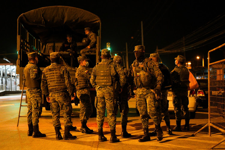 Members of the military gather outside of the Penitenciaria del Litoral, one of Ecuador's largest prisons, after prisoners died in a riot, in Guayaquil, Ecuador on September 29, 2021.