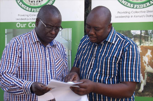 SHORTCHANGED: Kenya Dairy Farmers Federation chairman Richard Tuwei and CEO David Bett at the sector’s annual general meeting in Eldoret, Uasin Gishu county, yesterday.