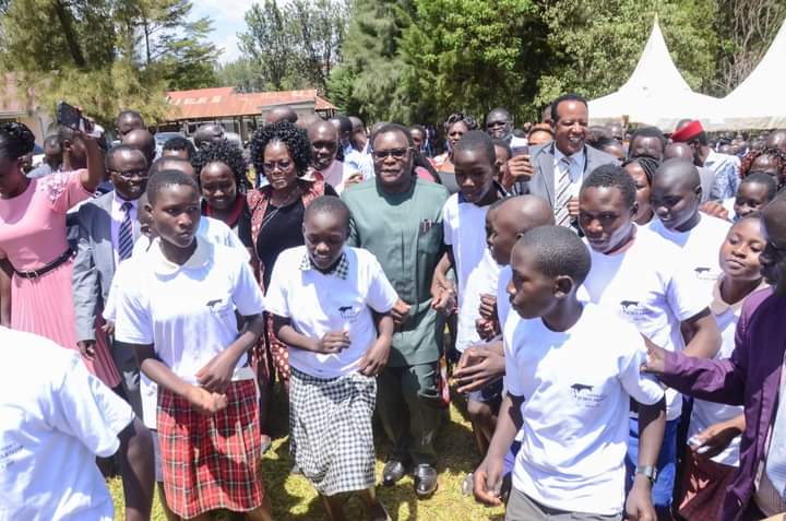 Governor Lusaka matching with the scholarship beneficiaries.