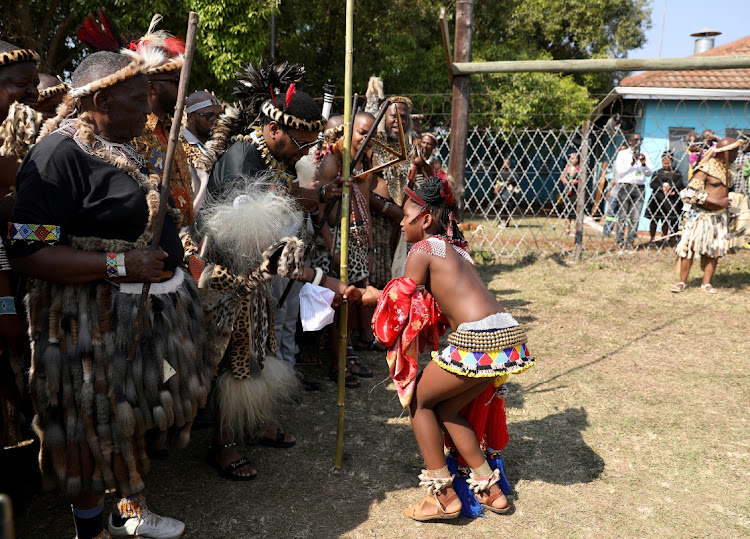 King Misuzulu kaZwelithini receives a reed from Princess Tensindiso during Umkhosi Womhlanga at Emachobeni Royal Palace in Ingwavuma.