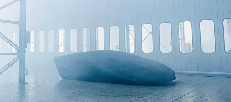 Lamborghini has released this teaser picture of a low-slung car under a cover. Picture: SUPPLIED