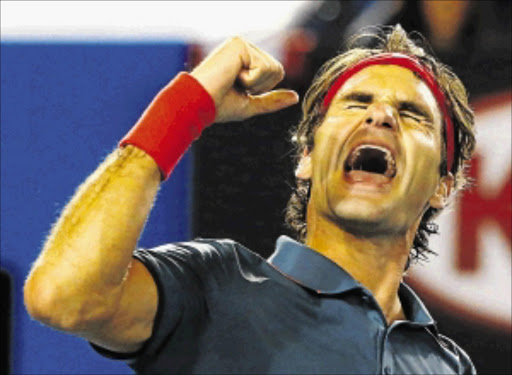 FIRED UP: Roger Federer celebrates defeating Andy Murray yesterday. Photo: Petar Kujundzic/REUTERS