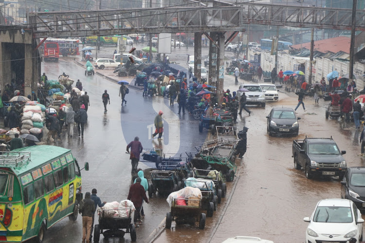 Motorists and pedestrians rush to work in Nairobi on November 16, 2022