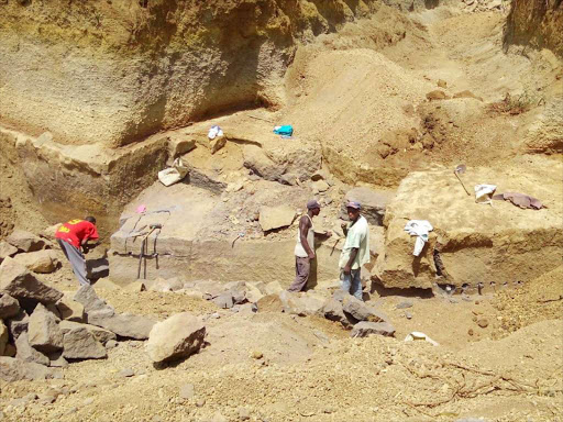 Workers at a quarry. /FILE